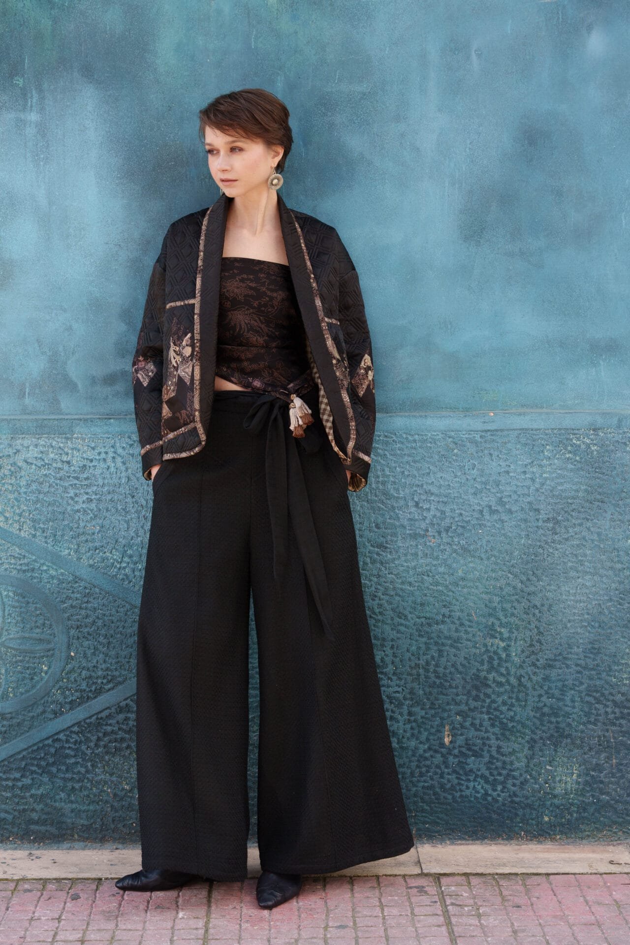 Black embroidered pleated pants