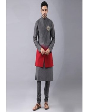 Shaded Bundi Jacket with Placement hand embroidery. It is paired with self dori work kurta and churidaar pyjama.